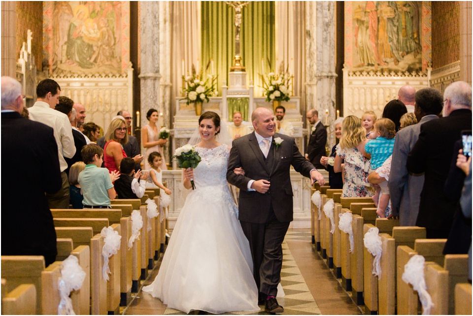 Bride and groom recessing up the aisle at St. Margaret of Scotland Church