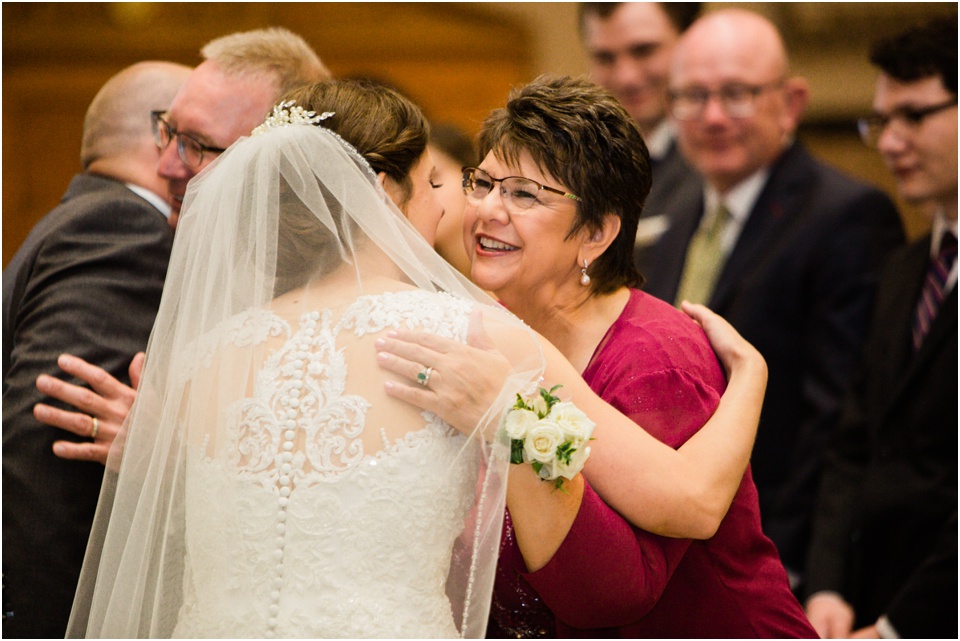 Bride hugging her mother during wedding