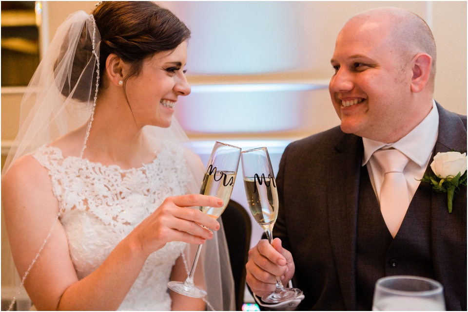 Couple toasting with Mr. and Mrs. champagne glasses
