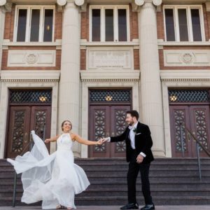 Bride and groom dancing on the steps at Sheldon theater in St. Louis Missouri