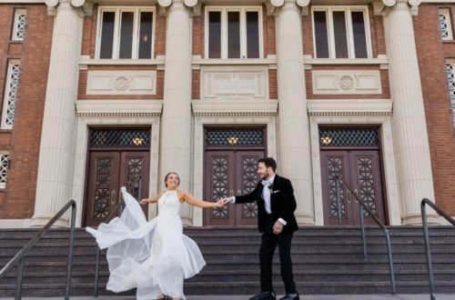 Bride and groom dancing on the steps at Sheldon theater in St. Louis Missouri