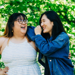Two Friends laughing together at the Missouri Botanical Garden.